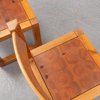 A set of six mid 20th century pine wood chairs with wheels.