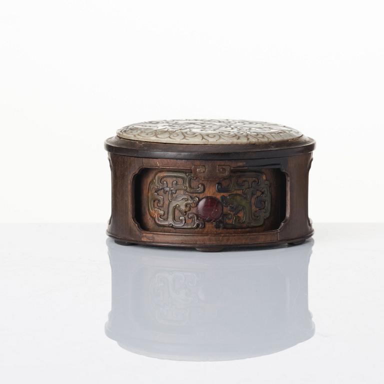 A well carved zitan and jade box, Qing dynasty, 18th century.