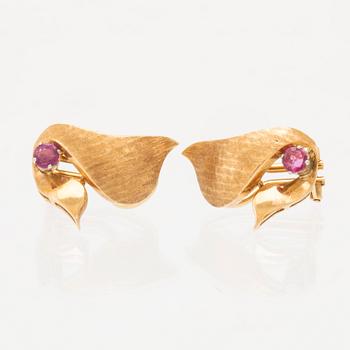 A pair of 18K gold earrings.