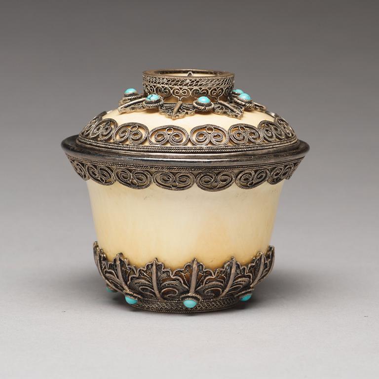 A bejewelled tibetan silver and turkoise bowl with cover, 19th Century.