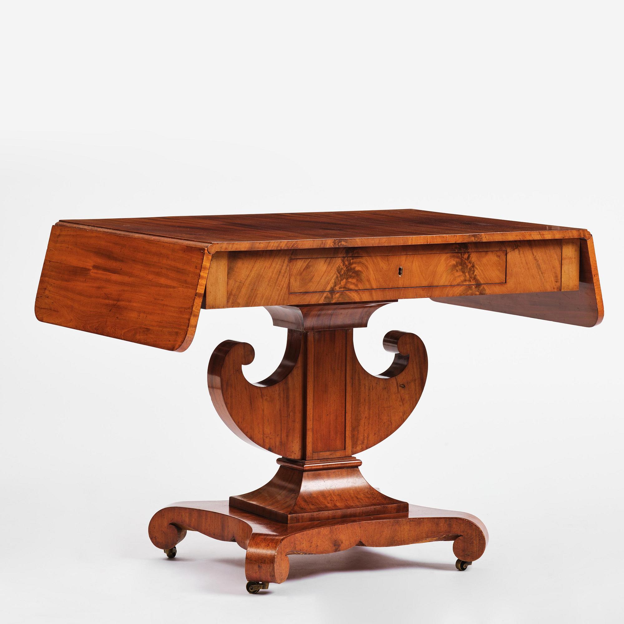 A Swedish Empire mahogany center table.