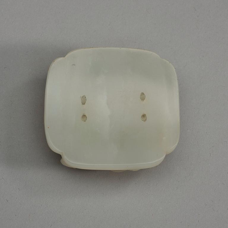 A carved white nephrite belt ornament, Qing dynasty (1644-1912).