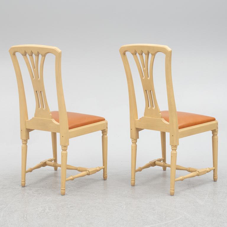A Gustavian style dining table with six dining chairs, Sweden, 21st century.