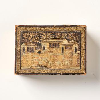 A lacquer tea box and a blanc de chine cup, Qing dynasty 18/19th century.