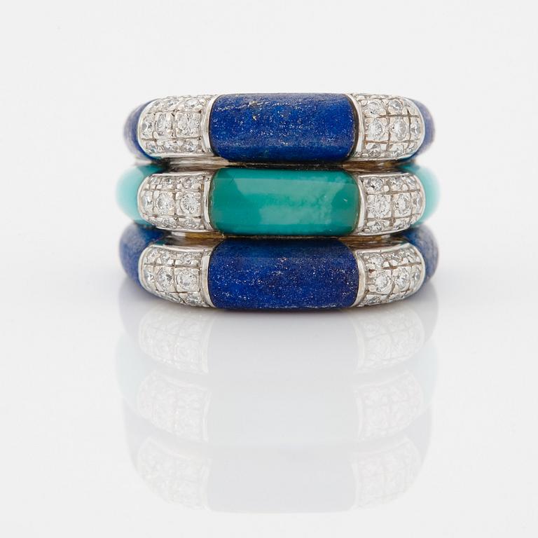 A Paul Binder ring in 18K white gold set with lapis lazuli, turquoise and round brilliant-cut diamonds.