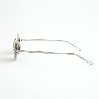 A pair of Uma Wang + Rigards, 'The Victorian', sunglasses and a Uma Wang, ipad case.