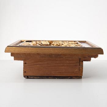 A Chinese wooden panel in deep relief, Qing dynasty, 19th century.