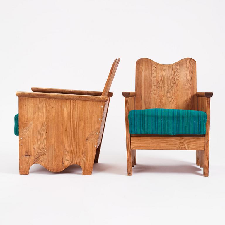 Axel Einar Hjorth, a pair of "Utö" stained pine armchairs, Nordiska Kompaniet 1930s.