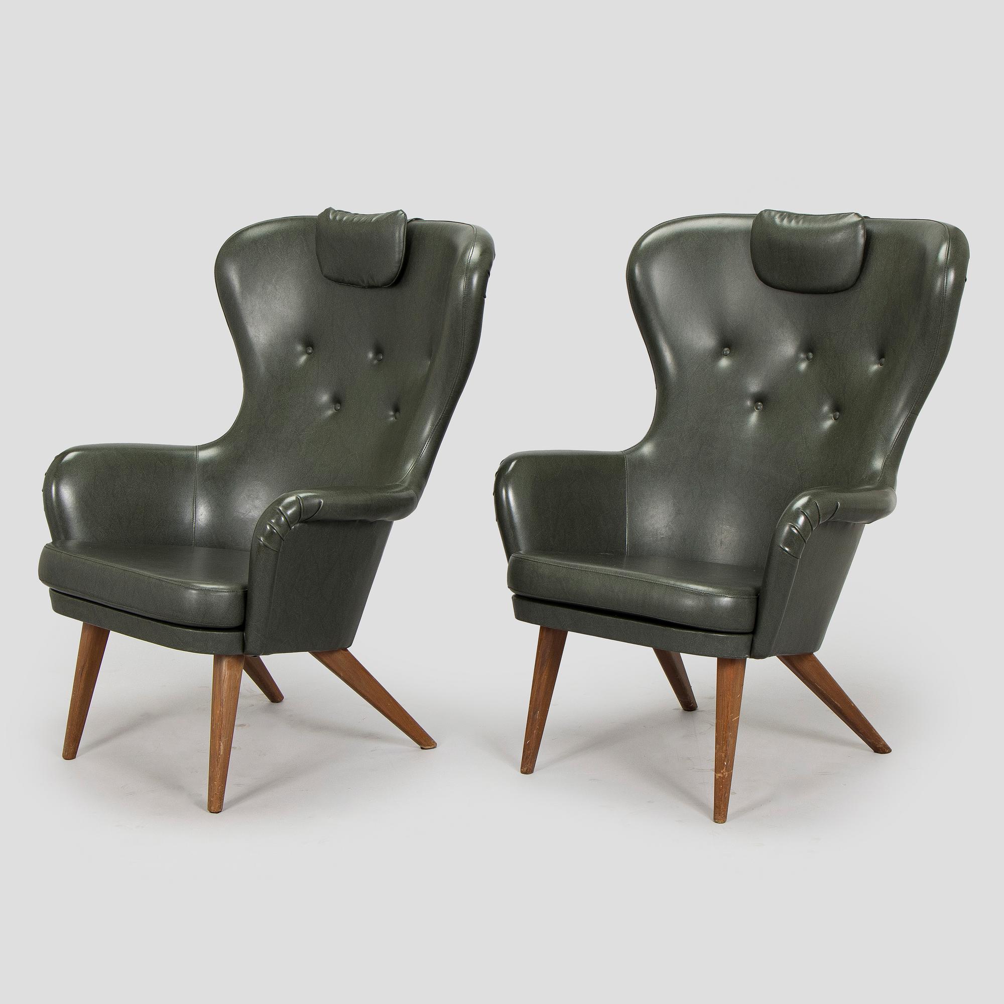 A pair of mid-20th century armchairs.