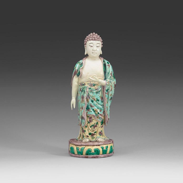 A famille verte figure of a standing Buddha, Qing dynasty, 19th Century.