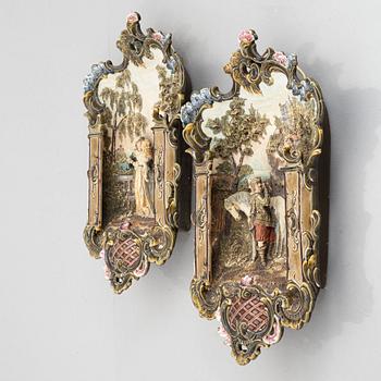 A pair of majolica wall reliefs, Majolika- und Steingutfabrik R.M. Krause, Schweidnitz, Germany, late 19th century.