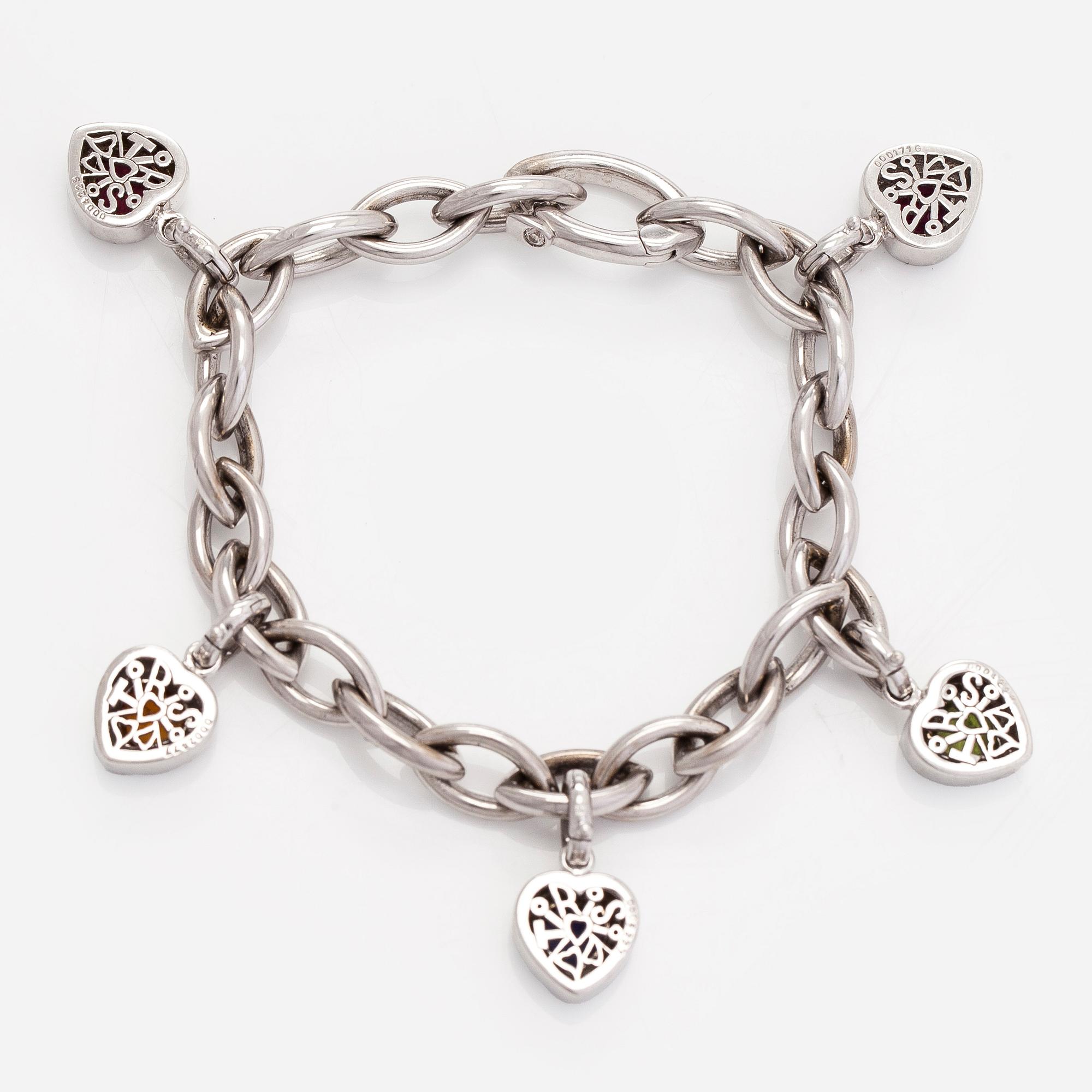 Armband, 18K vitguld med berlocker av hjärtslipade färgstenar och en briljantslipad diamant.