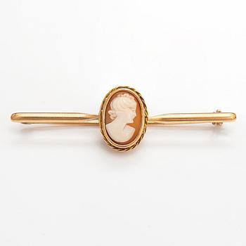 Two brooches and a ring, 14K and 18K gold and sea shell cameos.