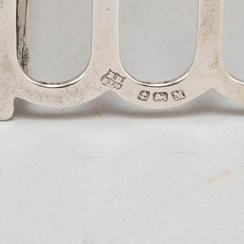 a set of four silver toastracks, Barker Brothers Birmingham 1936.