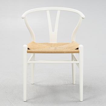 Hans J. Wegner, a model CH-24 chairs, Carl Hansen & Søn, Denmark.