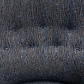 A lounge chair by Carl Malmsten, around the mid 20th century.