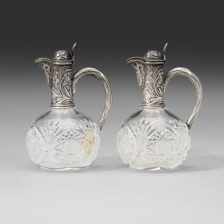 A pair of Russian 20th century parcel-gilt and glass flcongs, possibly of Ivan Katorsky, St. Petersburg 1899-1908.