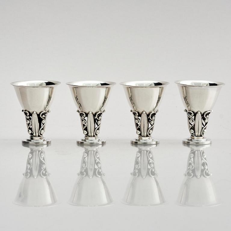 Evald Nielsen, four sterling silver beakers/cups on a foot, Denmark 20th century.