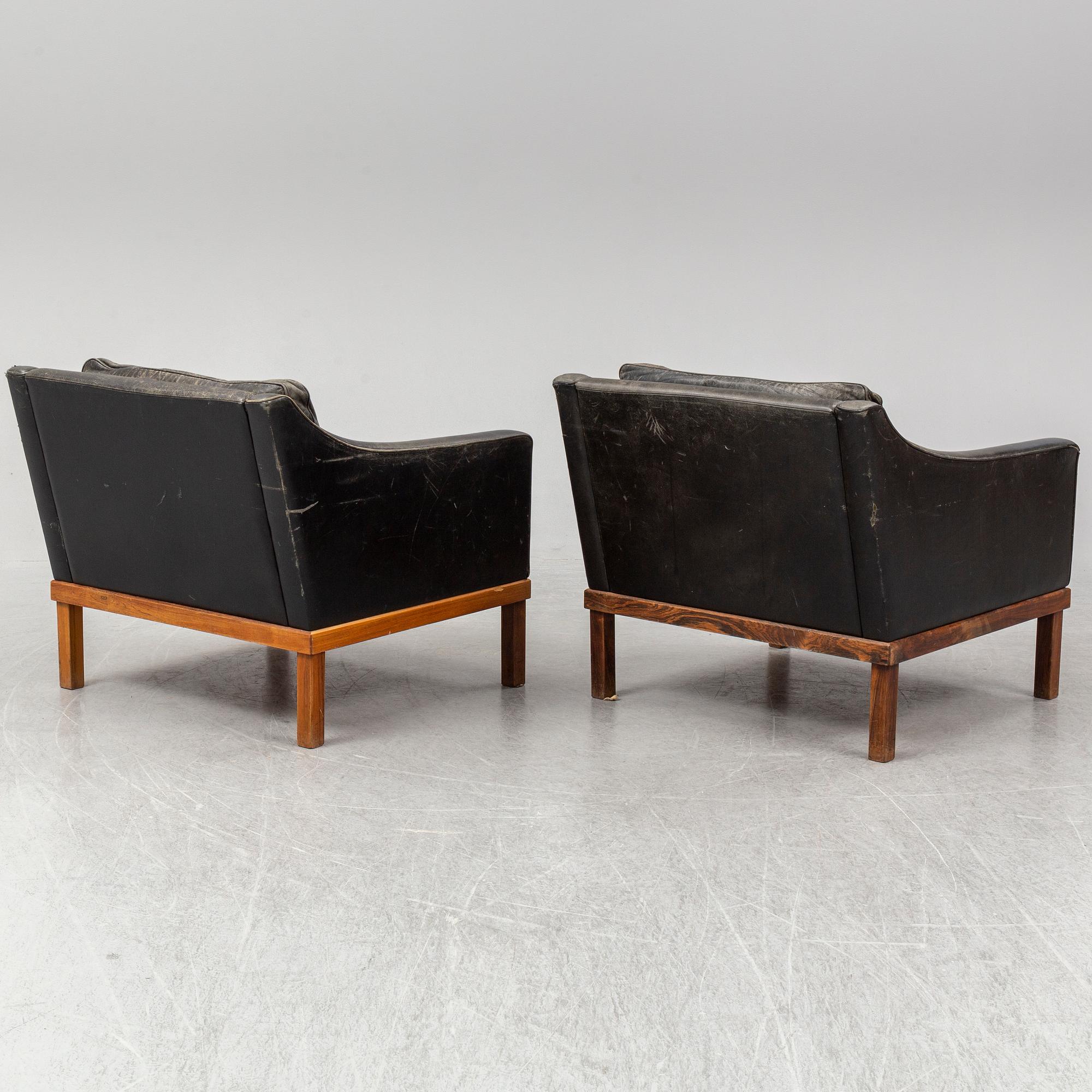 A pair of "The President" black leather armchairs by Ingemar Thillmark for OPE-möbler, Sweden.