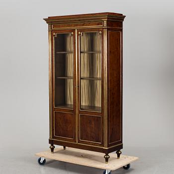 A Russian mahogany veneered display cabinet from around year 1900.
