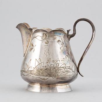 A Russian late 19th / early 20th century parcel-gilt silver cream-jug.