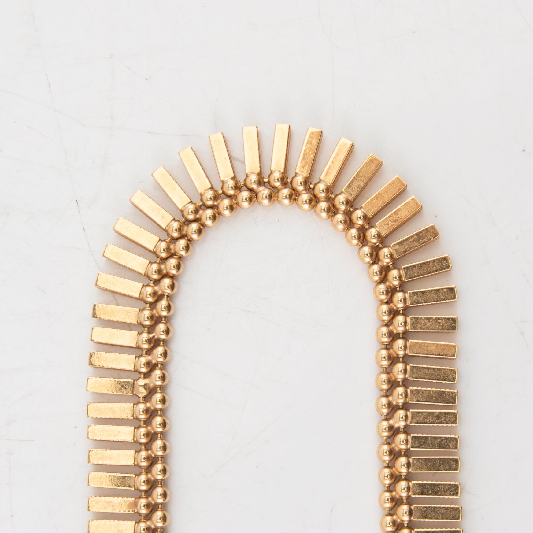 An 18K gold necklace by Unoaerre Italy.