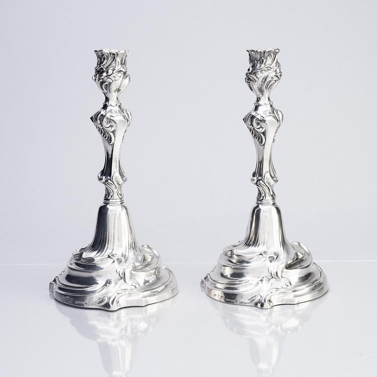 A pair of Swedish Rococo silver candlesticks, marks of Abraham Lundberg, Stockholm 1765.