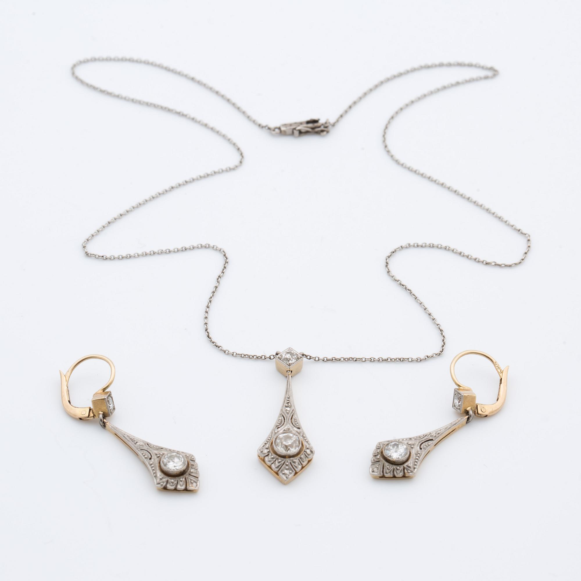 A pendant with a pair off earrings with old-cut diamonds ca 1.10 cts. 1920.