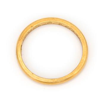 A 23K gold ring.