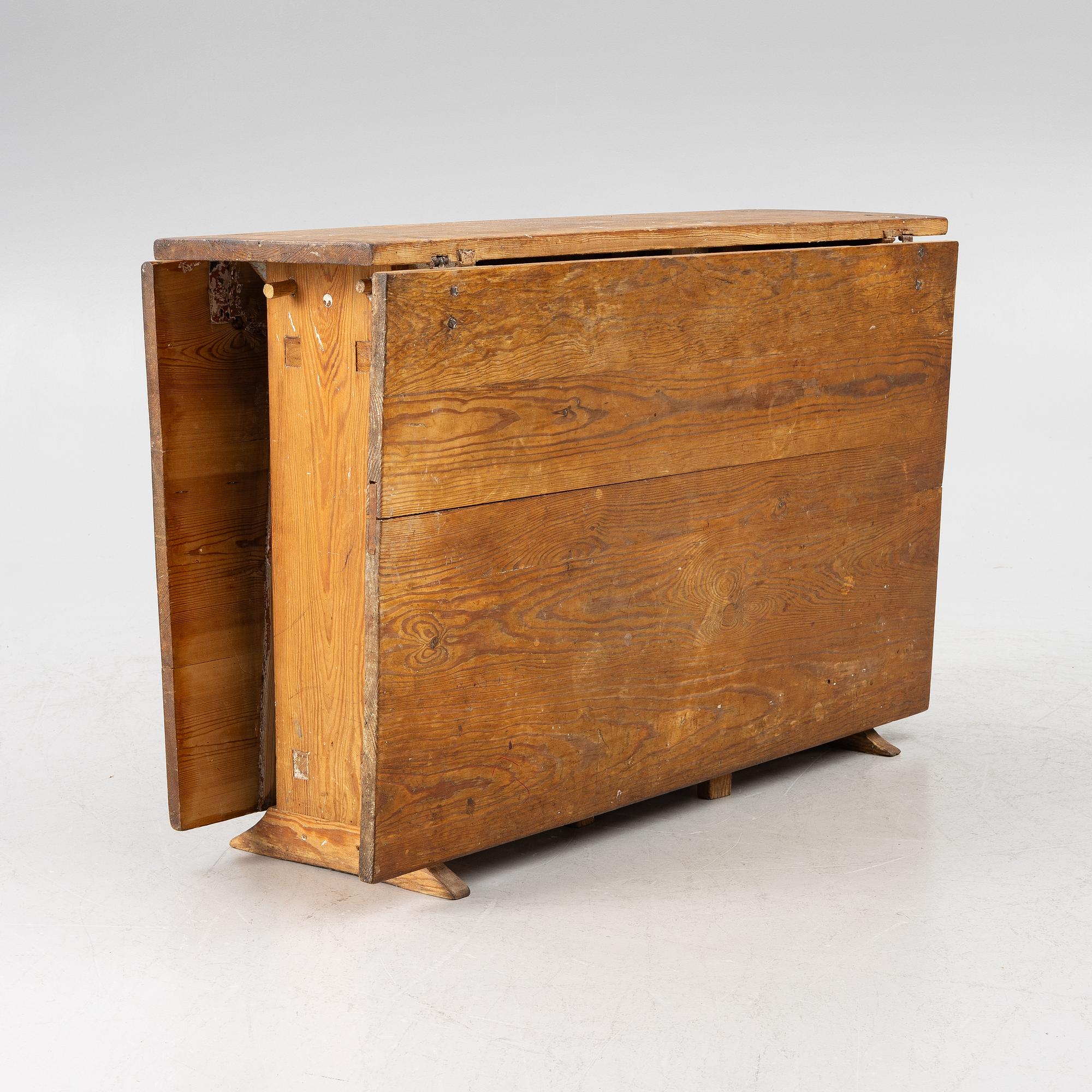 A drop-leaf table, 19th Century.