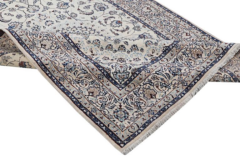 A Nain carpet, part silk, 6 laa, c. 294 x 193 cm.