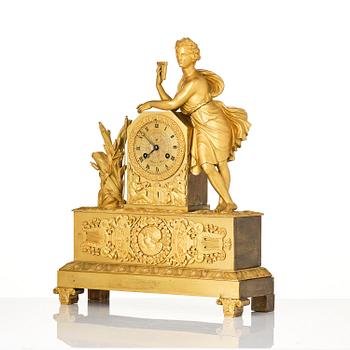 A French Empire ormolu and patinated bronze mantel clock, Paris, early 19th century.