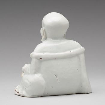 A blanc de chine figure of Buddai, Qing dynasty, 18th Century.