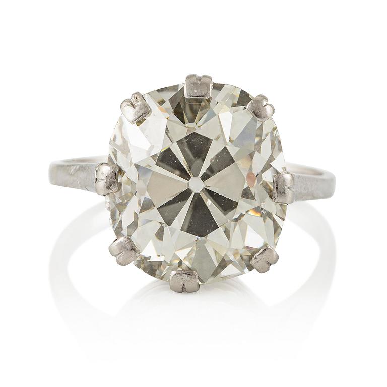 An 18K white gold ring set with a cushion-shaped old-cut diamond.
