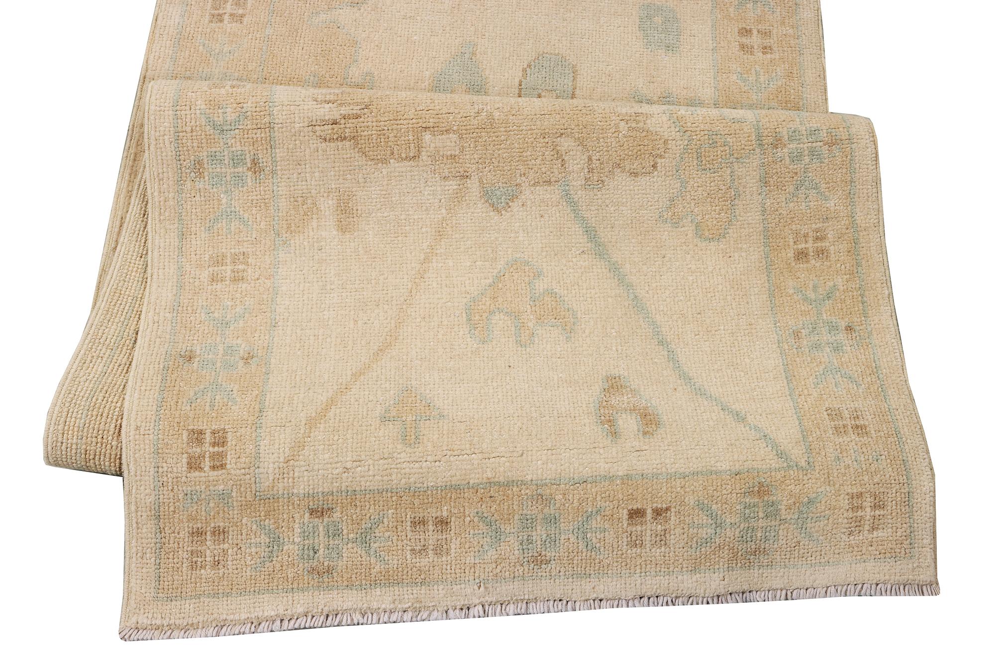 An Ushak runner carpet, c. 360 x 80 cm.