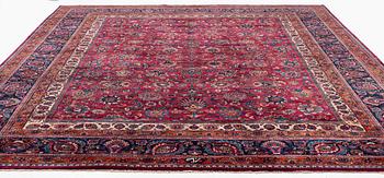 A Mashad carpet, signed Saber, c. 459 x 348 cm.