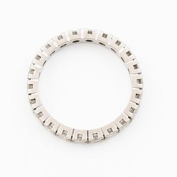 Ring, full eternity band in platinum set with round brilliant-cut diamonds.