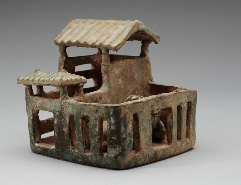 A green glazed pottery model of a house, Han dynasty (206 BC-220 AD).