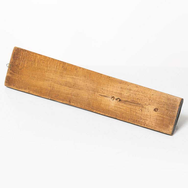 A painted wooden mangle board, dated 1831.