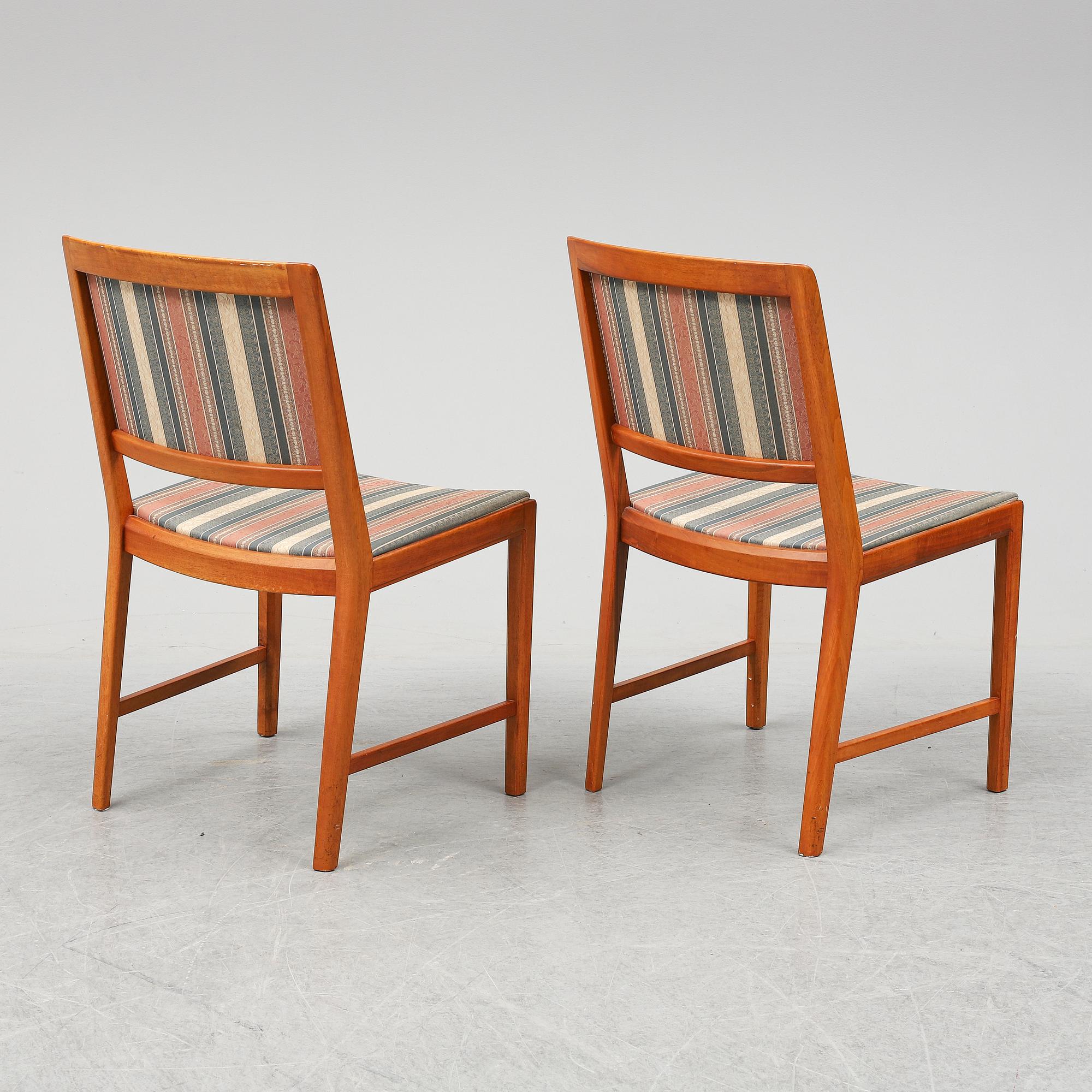 BERTIL FRIDHAGEN, a seven  piece walnut dining suite from Bodafors.