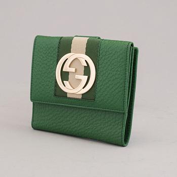 A wallet by Gucci.