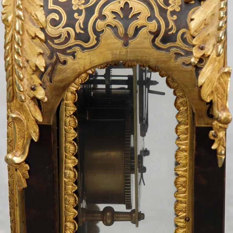 A French Boulle style mantel clock, 19th century.