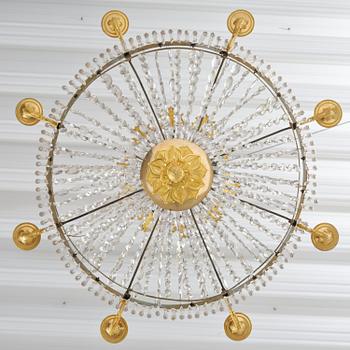 An French Empire eight-light gilt-brass and cut-glass chandelier.