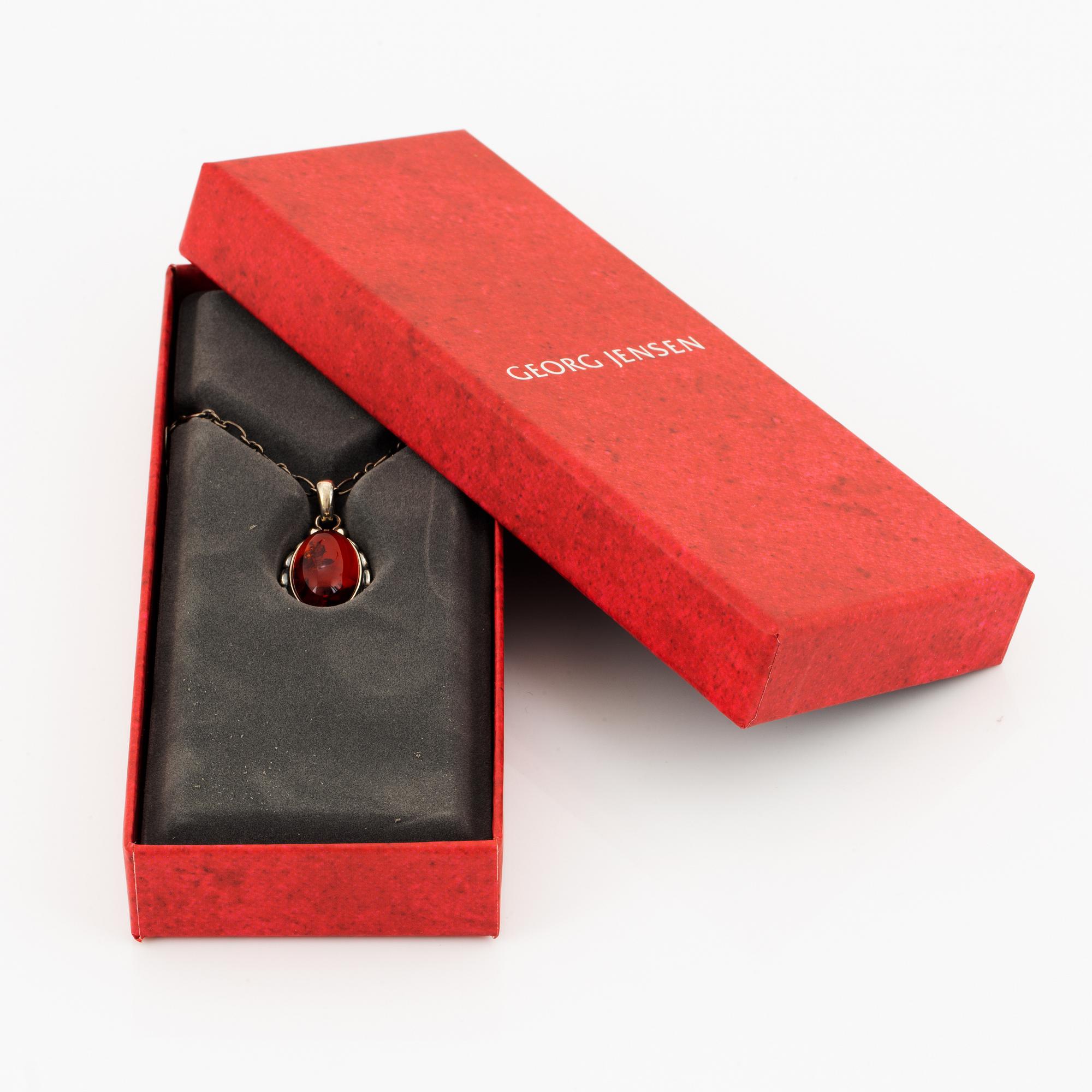 A Georg Jensen silver and cabochon-cut amber necklace.