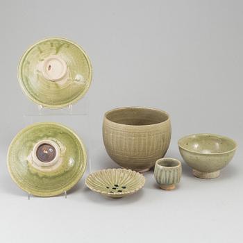 A group of olive green glazed bowls, South East Asia, 20th Century. (6 pieces).