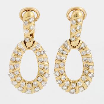 Brilliant-cut diamond earrings.