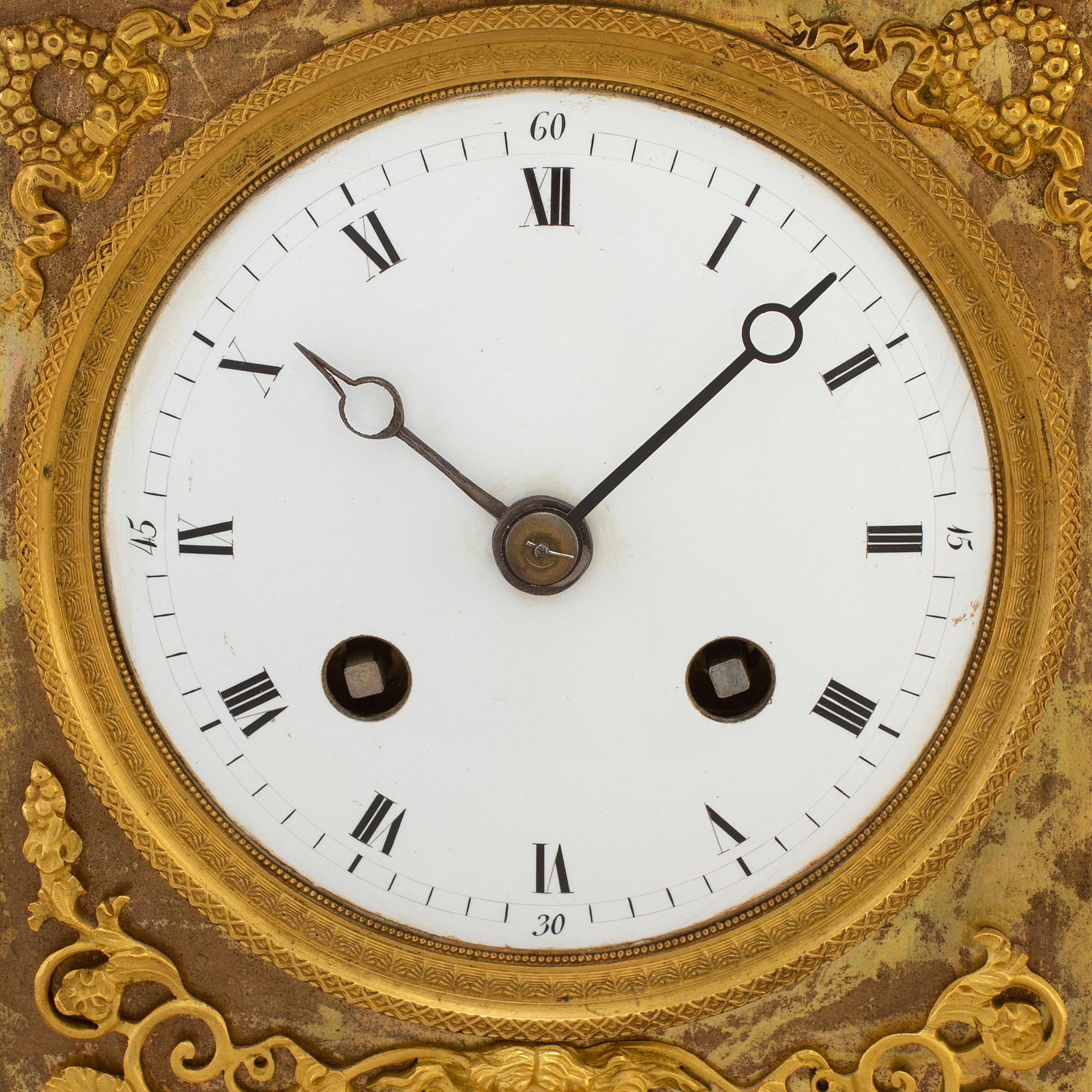 A French Empire gilt bronze mantel clock, first half of the 19th century.