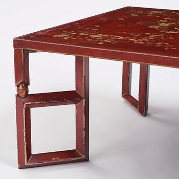 A Chinese red low table, 20th century.