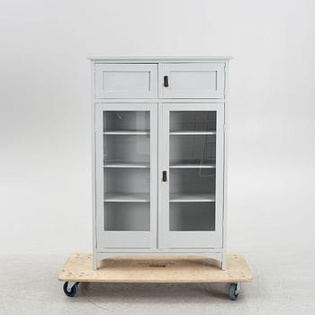 A display cabinet, early 20th Century.