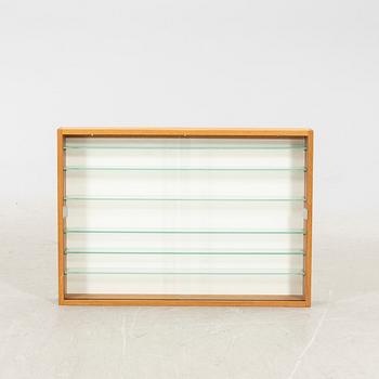 An oak display cabinet, later part of the 20th Century.